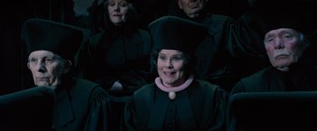 Movie still from “Harry Potter and the Order of the Phoenix” (2007), directed by David Yates – A group of people sitting next to each other; Medium shot, High angle