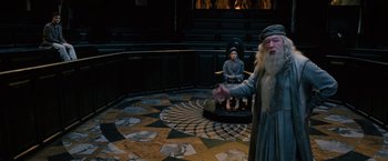 Movie still from “Harry Potter and the Order of the Phoenix” (2007), directed by David Yates – A statue of dumbledore and harry potter; Wide shot, High angle