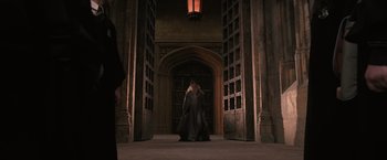 Movie still from “Harry Potter and the Order of the Phoenix” (2007), directed by David Yates – A couple of people that are standing in a room; Wide shot, Low angle