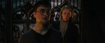 Movie still from “Harry Potter and the Order of the Phoenix” (2007), directed by David Yates – A man and a woman standing next to each other; Close Up shot, Over the shoulder angle