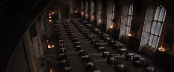 Movie still from “Harry Potter and the Order of the Phoenix” (2007), directed by David Yates – A room filled with lots of tables and chairs; Extreme Wide shot, High angle