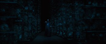 Movie still from “Harry Potter and the Order of the Phoenix” (2007), directed by David Yates – A man in a black robe stands in front of a wall; Wide shot, Low angle
