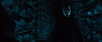 Movie still from “Harry Potter and the Order of the Phoenix” (2007), directed by David Yates – A man with a skull mask and a black robe; Medium shot, Low angle