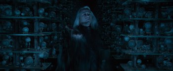 Movie still from “Harry Potter and the Order of the Phoenix” (2007), directed by David Yates – A man with a long white hair and a black shirt; Medium shot, Low angle