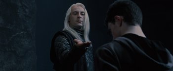 Movie still from “Harry Potter and the Order of the Phoenix” (2007), directed by David Yates – A man with long white hair is holding something in his hand; Medium shot, Over the shoulder angle