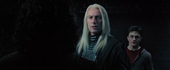 Movie still from “Harry Potter and the Order of the Phoenix” (2007), directed by David Yates – A person with long white hair; Close Up shot, Over the shoulder angle