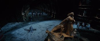 Movie still from “Harry Potter and the Order of the Phoenix” (2007), directed by David Yates – A group of people gathered around a statue of an angel; Extreme Wide shot, High angle