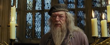 Movie still from “Harry Potter and the Prisoner of Azkaban” (2004), directed by Alfonso Cuarón – An old man with a long white beard wearing glasses; Close Up shot, Low angle