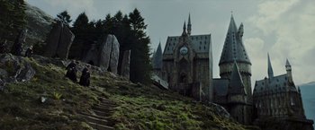 Movie still from “Harry Potter and the Prisoner of Azkaban” (2004), directed by Alfonso Cuarón – A castle like building with a clock on it's face; Extreme Wide shot, Low angle
