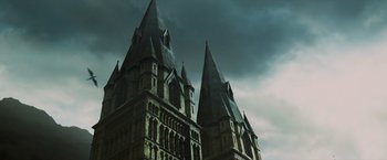 Movie still from “Harry Potter and the Prisoner of Azkaban” (2004), directed by Alfonso Cuarón – A large building that has two towers on top of it; Extreme Wide shot, Low angle