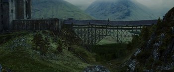 Movie still from “Harry Potter and the Prisoner of Azkaban” (2004), directed by Alfonso Cuarón – An old wooden bridge in the middle of a valley; Extreme Wide shot, High angle