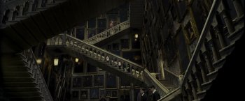 Movie still from “Harry Potter and the Prisoner of Azkaban” (2004), directed by Alfonso Cuarón – People are walking up and down a staircase; Extreme Wide shot, High angle