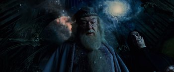 Movie still from “Harry Potter and the Prisoner of Azkaban” (2004), directed by Alfonso Cuarón – A man with long hair and a beard wearing glasses and a hat; Medium shot, Low angle