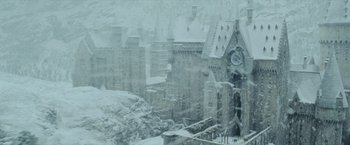 Movie still from “Harry Potter and the Prisoner of Azkaban” (2004), directed by Alfonso Cuarón – A castle like building with a clock on it's face; Extreme Wide shot, High angle