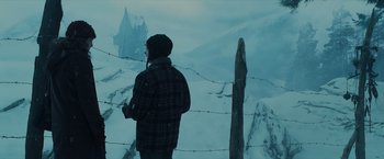 Movie still from “Harry Potter and the Prisoner of Azkaban” (2004), directed by Alfonso Cuarón – A man standing on top of a snow covered slope; Wide shot, Low angle