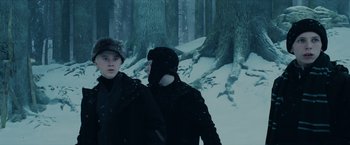 Movie still from “Harry Potter and the Prisoner of Azkaban” (2004), directed by Alfonso Cuarón – Two people standing next to each other in the snow; Medium shot, Low angle