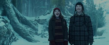 Movie still from “Harry Potter and the Prisoner of Azkaban” (2004), directed by Alfonso Cuarón – Two people standing next to each other in the snow; Medium shot, Low angle