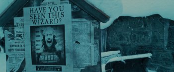 Movie still from “Harry Potter and the Prisoner of Azkaban” (2004), directed by Alfonso Cuarón – A newspaper with a picture on it's side; Extreme Close Up shot, High angle