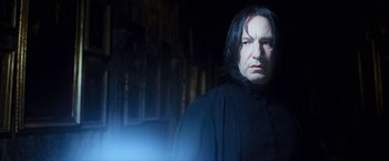 Movie still from “Harry Potter and the Prisoner of Azkaban” (2004), directed by Alfonso Cuarón – Severus snape in the dark with a light shining on him; Close Up shot, Low angle