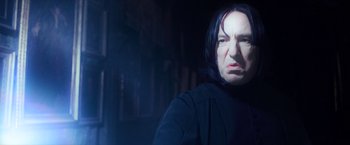 Movie still from “Harry Potter and the Prisoner of Azkaban” (2004), directed by Alfonso Cuarón – A person with long black hair; Close Up shot, Low angle