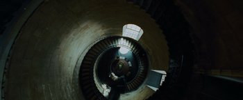 Movie still from “Harry Potter and the Prisoner of Azkaban” (2004), directed by Alfonso Cuarón – Looking down at a spiral staircase in a building; Extreme Wide shot, Overhead angle