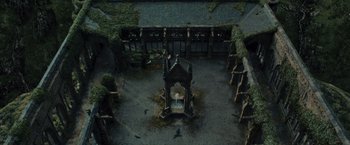 Movie still from “Harry Potter and the Prisoner of Azkaban” (2004), directed by Alfonso Cuarón – An aerial view of an old building with a gazebo; Extreme Wide shot, High angle