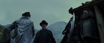 Movie still from “Harry Potter and the Prisoner of Azkaban” (2004), directed by Alfonso Cuarón – A group of men standing on top of a hill; Medium shot, Low angle