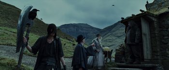 Movie still from “Harry Potter and the Prisoner of Azkaban” (2004), directed by Alfonso Cuarón – A group of people standing on top of a hill; Wide shot, Over the shoulder angle