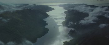 Movie still from “Harry Potter and the Prisoner of Azkaban” (2004), directed by Alfonso Cuarón – A bird flying over a body of water; Extreme Wide shot, Overhead angle