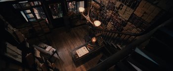 Movie still from “Harry Potter and the Sorcerer's Stone” (2001), directed by Chris Columbus – An overhead view of a room with a wooden floor; Wide shot, Overhead angle