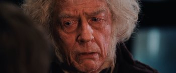 Movie still from “Harry Potter and the Sorcerer's Stone” (2001), directed by Chris Columbus – An old man with white hair and blue eyes; Close Up shot, Low angle