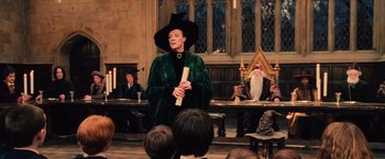 Movie still from “Harry Potter and the Sorcerer's Stone” (2001), directed by Chris Columbus – A woman dressed in a witch costume and holding a wand; Medium shot, Low angle