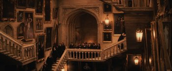 Movie still from “Harry Potter and the Sorcerer's Stone” (2001), directed by Chris Columbus – A group of people standing on top of a set of stairs; Extreme Wide shot, High angle