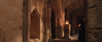 Movie still from “Harry Potter and the Sorcerer's Stone” (2001), directed by Chris Columbus – A pillar with a candle inside of an old building; Extreme Wide shot, High angle