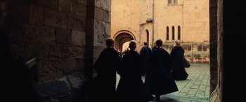 Movie still from “Harry Potter and the Sorcerer's Stone” (2001), directed by Chris Columbus – A group of people walking down a street; Wide shot, High angle