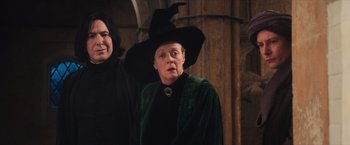 Movie still from “Harry Potter and the Sorcerer's Stone” (2001), directed by Chris Columbus – A woman dressed as harry potter is standing next to another woman; Medium shot, Low angle
