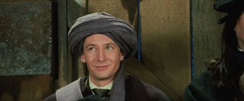 Movie still from “Harry Potter and the Sorcerer's Stone” (2001), directed by Chris Columbus – A man wearing a turban and wearing a tie; Close Up shot, Low angle