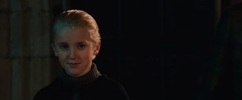 Movie still from “Harry Potter and the Sorcerer's Stone” (2001), directed by Chris Columbus – A woman with blonde hair wearing a black sweater; Close Up shot, Low angle