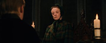 Movie still from “Harry Potter and the Sorcerer's Stone” (2001), directed by Chris Columbus – An older woman wearing a green and brown coat; Close Up shot, Low angle