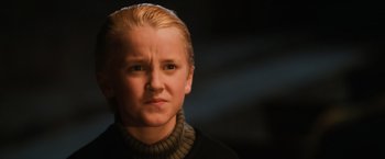 Movie still from “Harry Potter and the Sorcerer's Stone” (2001), directed by Chris Columbus – A woman with blonde hair wearing a black sweater; Close Up shot, Low angle