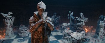 Movie still from “Harry Potter and the Sorcerer's Stone” (2001), directed by Chris Columbus – A statue of a knight playing the flute; Wide shot, High angle