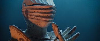 Movie still from “Harry Potter and the Sorcerer's Stone” (2001), directed by Chris Columbus – View of a knight's helmet and gauntlets; Close Up shot, Low angle