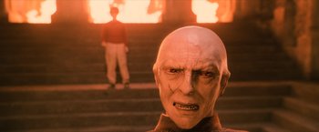 Movie still from “Harry Potter and the Sorcerer's Stone” (2001), directed by Chris Columbus – An image of a man that is wearing a mask; Close Up shot, Low angle
