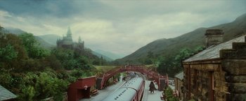 Movie still from “Harry Potter and the Sorcerer's Stone” (2001), directed by Chris Columbus – A train on the tracks near a bridge; Extreme Wide shot, High angle