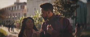 Movie still from “Haunted Mansion” (2023), directed by Justin Simien – A man and a woman standing next to each other outside; Medium shot, Over the shoulder angle