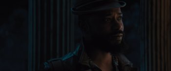 Movie still from “Haunted Mansion” (2023), directed by Justin Simien – A person wearing a hat; Close Up shot, Low angle