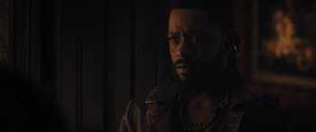 Movie still from “Haunted Mansion” (2023), directed by Justin Simien – A person wearing a jacket; Close Up shot, Over the shoulder angle