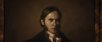 Movie still from “Haunted Mansion” (2023), directed by Justin Simien – A painting of a man in a suit and tie; Close Up shot, Low angle