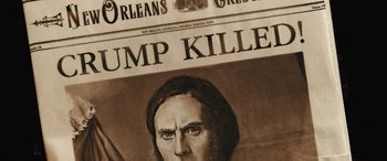 Movie still from “Haunted Mansion” (2023), directed by Justin Simien – An old newspaper with a picture of a man on it; Extreme Close Up shot, Low angle