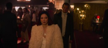 Movie still from “Heart of Stone” (2023), directed by Tom Harper – A man and a woman walking down a street; Medium shot, Over the shoulder angle